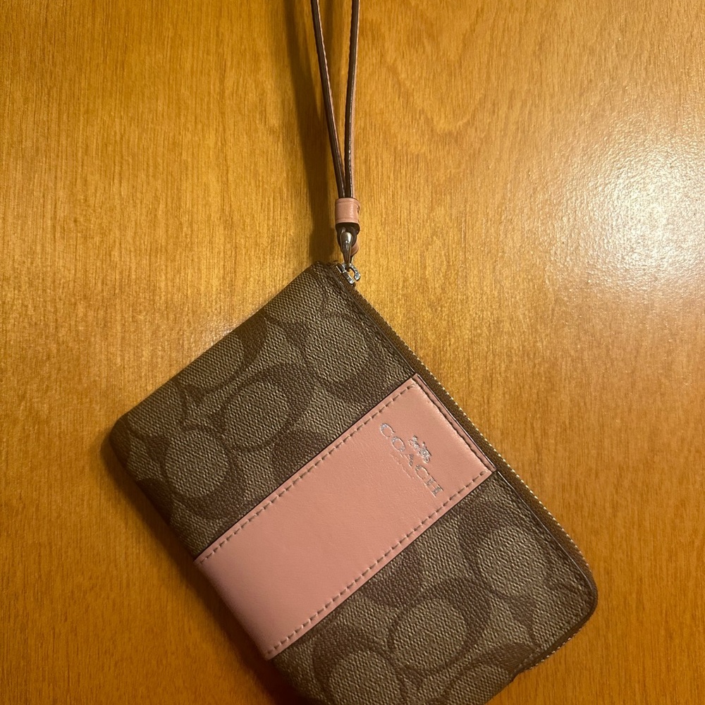 Coach wristlet. Pink stripe, good/used condition